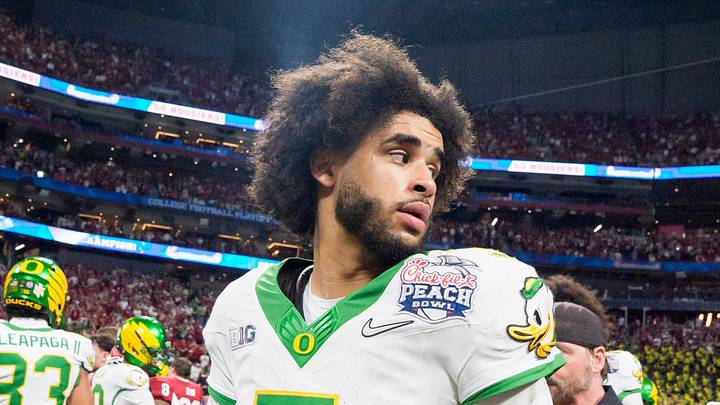 Oregon quarterback Dante Moore walks the field after the Ducks’ loss as the Oregon Ducks face the Indiana Hoosiers in the Peach Bowl on Jan. 9, 2026, at Mercedes-Benz Stadium in Atlanta, Georgia Oregon quarterback Dante Moore walks the field after the Ducks’ loss as the Oregon Ducks face the Indiana Hoosiers in the Peach Bowl on Jan. 9, 2026, at Mercedes-Benz Stadium in Atlanta, Georgia