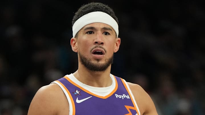 Feb 7, 2026; Phoenix, Arizona, USA; Phoenix Suns guard Devin Booker (1) reacts after a foul call against the Philadelphia 76ers during the second half of an NBA game at Mortgage Matchup Center. Mandatory Credit: Rick Scuteri-Imagn Images