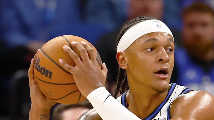 Washington Wizards guard Bub Carrington attempts to defend Orlando Magic forward Paolo Banchero.