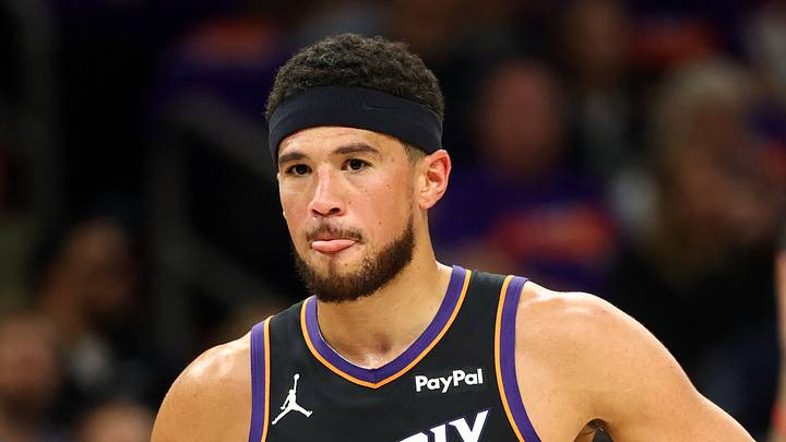 Phoenix Suns guard Devin Booker (1) reacts against the Portland Trail Blazers in the first half during the play-in rounds of the 2026 NBA Playoffs at Mortgage Matchup Center on April 14, 2026. Phoenix Suns guard Devin Booker (1) reacts against the Portland Trail Blazers in the first half during the play-in rounds of the 2026 NBA Playoffs at Mortgage Matchup Center on April 14, 2026.