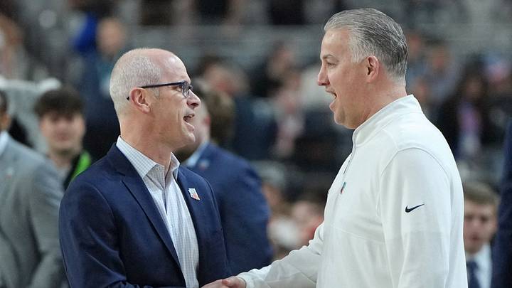 Connecticut Huskies head coach Dan Hurley shakes hands with Purdue Boilermakers head coach Matt Painter. Connecticut Huskies head coach Dan Hurley shakes hands with Purdue Boilermakers head coach Matt Painter.