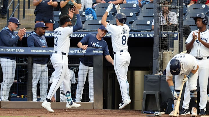 Tampa Bay's Brandon Lowe (right) is congratulated by Junior Caminero after he hit a home run against the Texas Rangers on Wednesday.