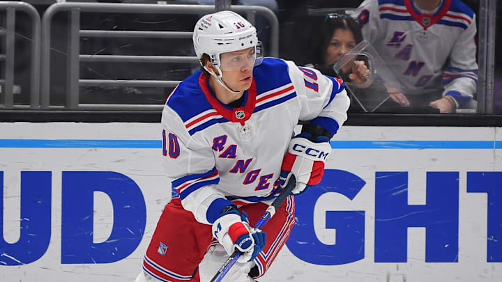 Mar 25, 2025; Los Angeles, California, USA; New York Rangers left wing Artemi Panarin (10) controls the puck against the New York Rangers during the first period at Crypto.com Arena. Mandatory Credit: Gary A. Vasquez-Imagn Images