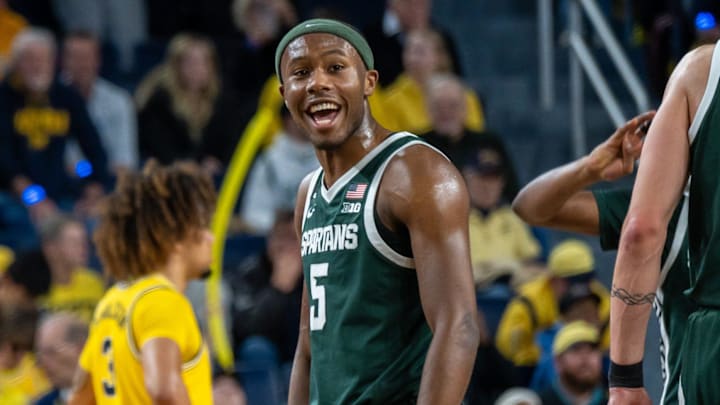 Michigan State’s Tre Holloman celebrates after the Spartans beat Michigan 75-62 in their rivalry matchup at Crisler Center in Ann Arbor on Friday, Feb. 21, 2025.