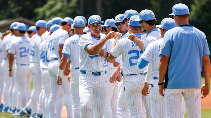 Jun 8, 2025; Chapel Hill, NC, USA;  North Carolina Head Coach Scott Forbes high fives the ream before the first inning of the Super Regionals game against Arizona in Chapel Hill, North Carolina. Mandatory Credit: Jaylynn Nash-Imagn Images