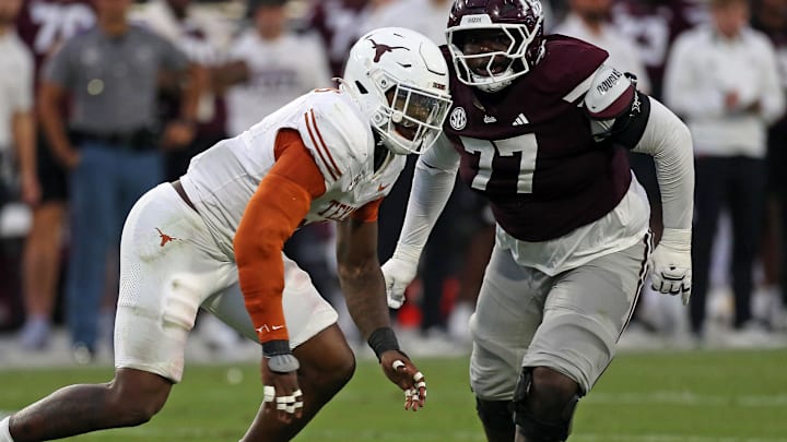 Texas Longhorns defensive linemen Colin Simmons gets past Mississippi State Bulldogs offensive linemen Jayvin Q. James during the third quarter at Davis Wade Stadium at Scott Field.