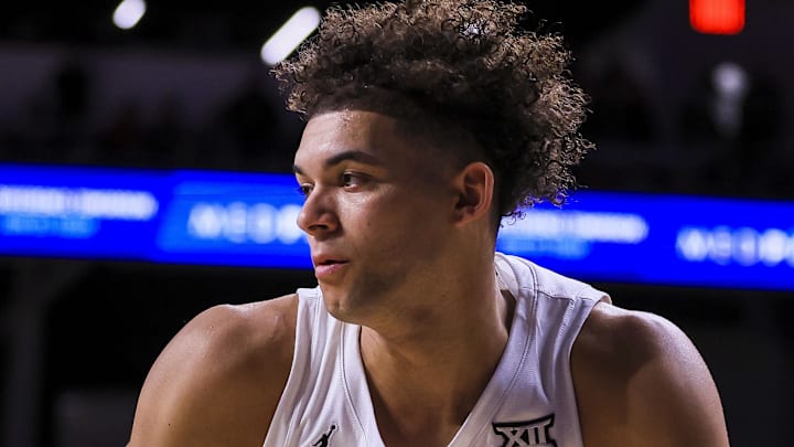 Feb 8, 2025; Cincinnati, Ohio, USA; Cincinnati Bearcats guard Dan Skillings Jr. (0) dribbles against the Brigham Young Cougars in the first half at Fifth Third Arena. Mandatory Credit: Katie Stratman-Imagn Images
