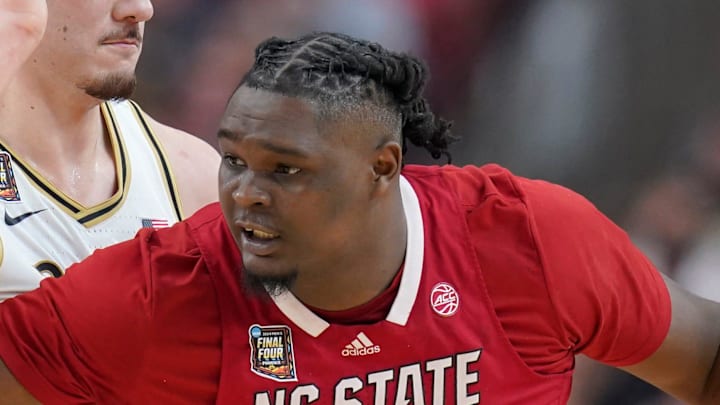 Purdue Boilermakers center Zach Edey (15) defends North Carolina State Wolfpack forward DJ Burns Jr. (30) during the NCAA Men’s Basketball Tournament Final Four game, Saturday, April 6, 2024, at State Farm Stadium in Glendale, Ariz.