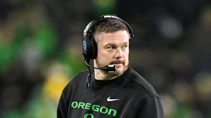 Dec 20, 2025; Eugene, OR, USA;  Oregon Ducks head coach Dan Lanning looks on during the fourth quarter against the James Madison Dukes at Autzen Stadium. Mandatory Credit: Craig Strobeck-Imagn Images
