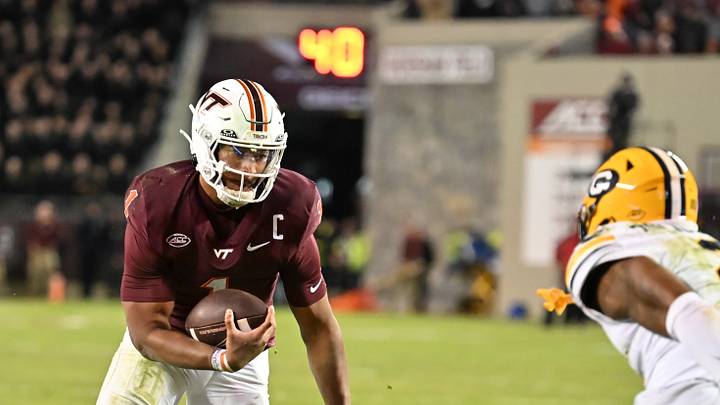Oct 24, 2025; Blacksburg, Va.; Virginia Tech quarterback Kyron Drones (1) runs the ball for a two-point conversion during the second overtime period. Oct 24, 2025; Blacksburg, Va.; Virginia Tech quarterback Kyron Drones (1) runs the ball for a two-point conversion during the second overtime period.