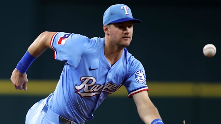 Jun 29, 2025; Arlington, Texas, USA; Texas Rangers third base Josh Jung (6) commits a fielding error during the fourth inning against the Seattle Mariners at Globe Life Field. Mandatory Credit: Jun 29, 2025; Arlington, Texas, USA; Texas Rangers third base Josh Jung (6) commits a fielding error during the fourth inning against the Seattle Mariners at Globe Life Field. Mandatory Credit: