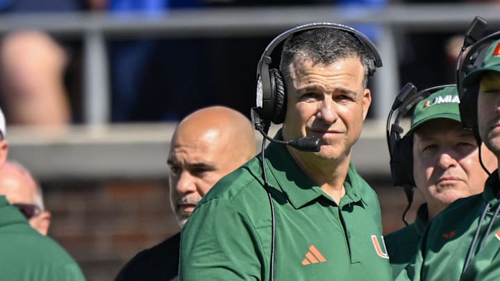 Nov 1, 2025; Dallas, Texas, USA; Miami Hurricanes head coach Mario Cristobal looks on during the game between the Mustangs and the Hurricanes at Gerald J. Ford Stadium. Mandatory Credit: Jerome Miron-Imagn Images Nov 1, 2025; Dallas, Texas, USA; Miami Hurricanes head coach Mario Cristobal looks on during the game between the Mustangs and the Hurricanes at Gerald J. Ford Stadium. Mandatory Credit: Jerome Miron-Imagn Images