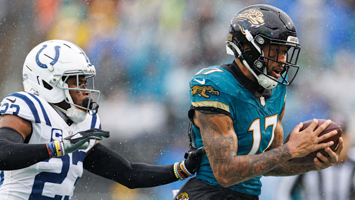 Dec 7, 2025; Jacksonville, Florida, USA; Jacksonville Jaguars wide receiver Tim Patrick (17) makes a catch over Indianapolis Colts cornerback Kenny Moore II (23) during the second half at EverBank Stadium. Mandatory Credit: Matt Pendleton-Imagn Images