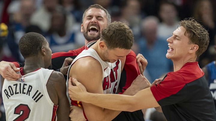 Nov 10, 2024; Minneapolis, Minnesota, USA; Miami Heat forward Nikola Jovic (5) (middle) celebrates with teammates after defeating the Minnesota Timberwolves at Target Center. Mandatory Credit: Jesse Johnson-Imagn Images Nov 10, 2024; Minneapolis, Minnesota, USA; Miami Heat forward Nikola Jovic (5) (middle) celebrates with teammates after defeating the Minnesota Timberwolves at Target Center. Mandatory Credit: Jesse Johnson-Imagn Images