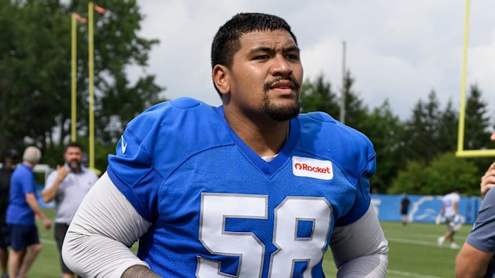 Detroit Lions offensive tackle Penei Sewell (58) runs off the field after training camp practice
