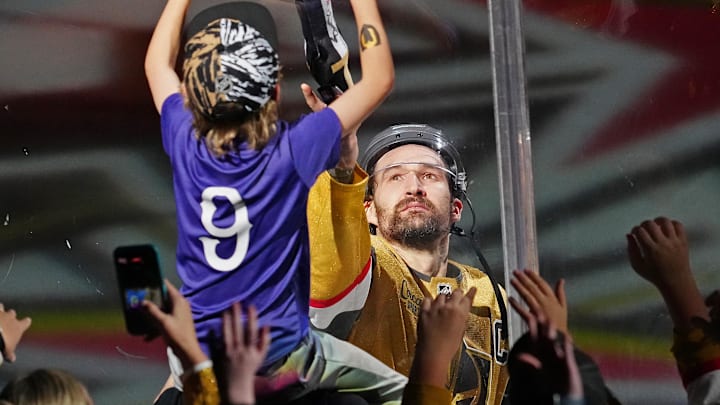 Feb 5, 2026; Las Vegas, Nevada, USA; Vegas Golden Knights right wing Mark Stone (61) hands a souvenir to a fan after being named Second Star of the Knight after the Golden Knights defeated the Los Angeles Kings 4-1 at T-Mobile Arena. Mandatory Credit: Stephen R. Sylvanie-Imagn Images