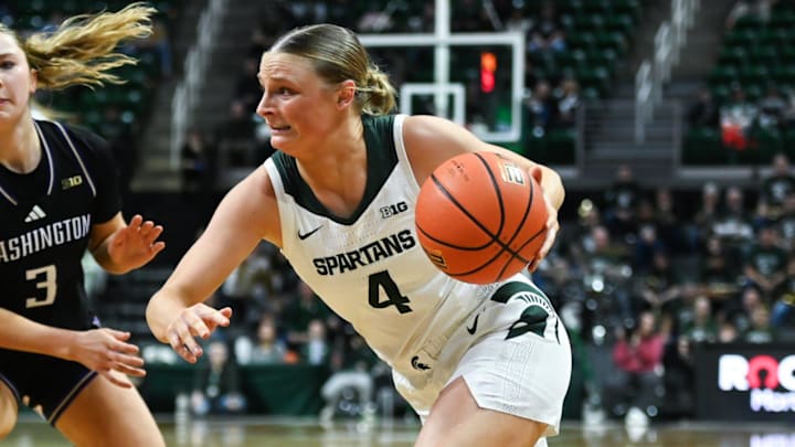 MSU's Theryn Hallock moves the ball against Devin Coppinger of the Washington Huskies, Sunday, Jan. 12, 2025, at the Breslin Center in East Lansing. MSU won 80-68.
