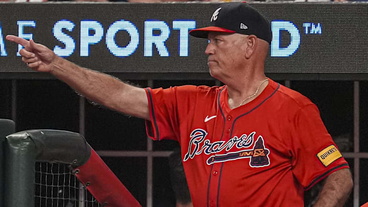 Atlanta Braves manager Brian Snitker (43) points from the dugout steps against the Miami Marlins during the eighth inning at Truist Park.