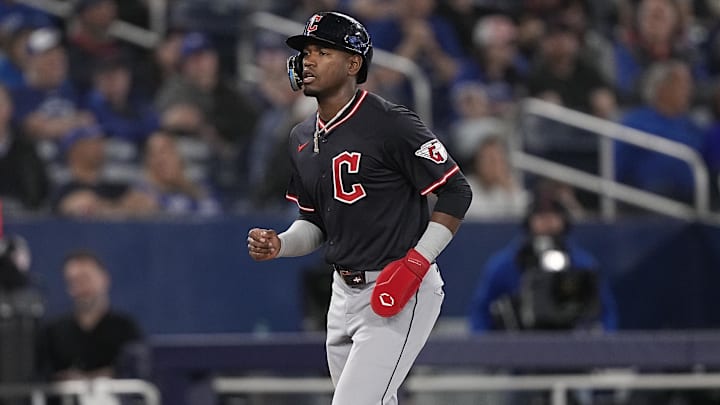 May 4, 2025; Toronto, Ontario, CAN; Cleveland Guardians center fielder Angel Martinez (1) is walked home by Toronto Blue Jays pitcher Brendon Little (not pictured) during the ninth inning at Rogers Centre. Mandatory Credit: John E. Sokolowski-Imagn Images May 4, 2025; Toronto, Ontario, CAN; Cleveland Guardians center fielder Angel Martinez (1) is walked home by Toronto Blue Jays pitcher Brendon Little (not pictured) during the ninth inning at Rogers Centre. Mandatory Credit: John E. Sokolowski-Imagn Images