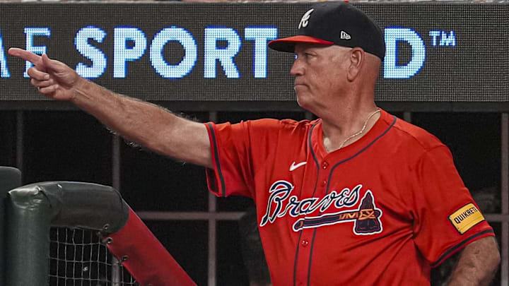 Atlanta Braves manager Brian Snitker (43) points from the dugout steps against the Miami Marlins during the eighth inning at Truist Park.