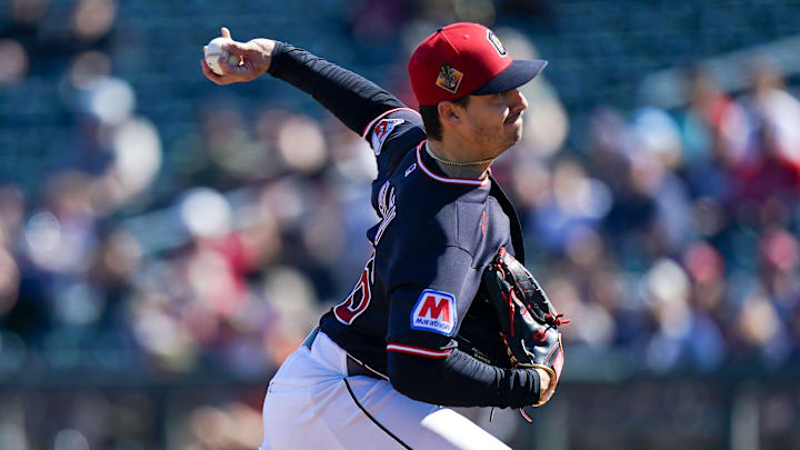 Cleveland Guardians pitcher Logan Allen (26) delivers a pitch in the first inning of a Cactus League game between the Cincinnati Reds and Cleveland Guardians, Saturday, Feb. 21, 2026, at Goodyear Ballpark in Goodyear, Ariz.