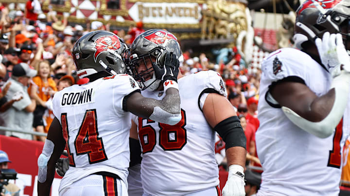 Tampa Bay Buccaneers wide receiver Chris Godwin celebrates with guard Ben Bredeson after he scored a touchdown against the Denver Broncos. Tampa Bay Buccaneers wide receiver Chris Godwin celebrates with guard Ben Bredeson after he scored a touchdown against the Denver Broncos.