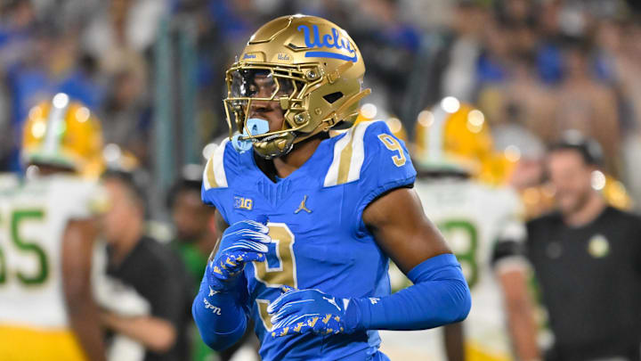 Sep 28, 2024; Pasadena, California, USA;  UCLA Bruins quarterback Dermaricus Davis (9) during the first quarter against the Oregon Ducks at Rose Bowl. Mandatory Credit: Robert Hanashiro-Imagn Images