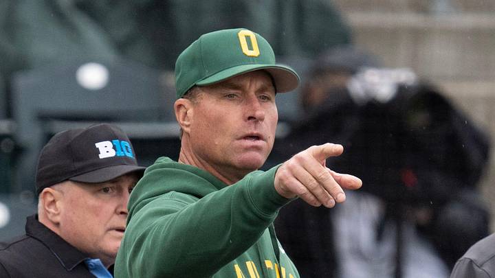 Oregon coach Mark Wasikowski, center, points out features of PK Park to Indiana coach Jeff Mercer before their game at PK Park in Eugene March 13, 2026. Oregon coach Mark Wasikowski, center, points out features of PK Park to Indiana coach Jeff Mercer before their game at PK Park in Eugene March 13, 2026.