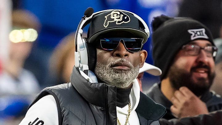 Nov 23, 2024; Kansas City, Missouri, USA; Colorado head coach Deion Sanders watches the run of play during the 3rd quarter between the Kansas Jayhawks and the Colorado Buffaloes at GEHA Field at Arrowhead Stadium. Mandatory Credit: Nick Tre. Smith-Imagn Images Nov 23, 2024; Kansas City, Missouri, USA; Colorado head coach Deion Sanders watches the run of play during the 3rd quarter between the Kansas Jayhawks and the Colorado Buffaloes at GEHA Field at Arrowhead Stadium. Mandatory Credit: Nick Tre. Smith-Imagn Images