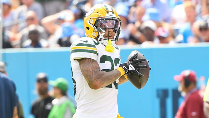 Sep 22, 2024; Nashville, Tennessee, USA;  Green Bay Packers cornerback Jaire Alexander (23) scores a touchdown on an interception thrown by Tennessee Titans quarterback Will Levis (8) during the first half at Nissan Stadium. Mandatory Credit: Steve Roberts-Imagn Images