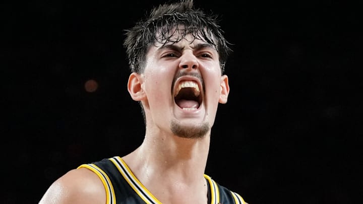 Michigan Wolverines center Aday Mara (15) reacts after a play against the Arizona Wildcats during the first half in a semifinal of the Final Four of the men's 2026 NCAA Tournament at Lucas Oil Stadium on April 4th, 2026.