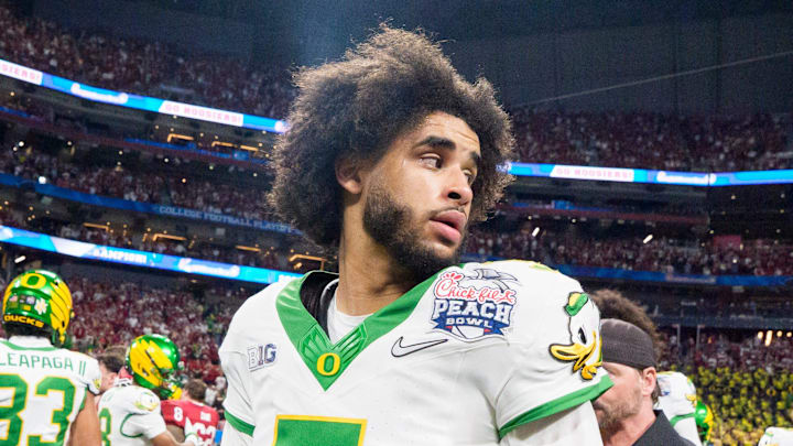 Oregon quarterback Dante Moore walks the field after the Ducks’ loss as the Oregon Ducks face the Indiana Hoosiers in the Peach Bowl on Jan. 9, 2026, at Mercedes-Benz Stadium in Atlanta, Georgia. Oregon quarterback Dante Moore walks the field after the Ducks’ loss as the Oregon Ducks face the Indiana Hoosiers in the Peach Bowl on Jan. 9, 2026, at Mercedes-Benz Stadium in Atlanta, Georgia.