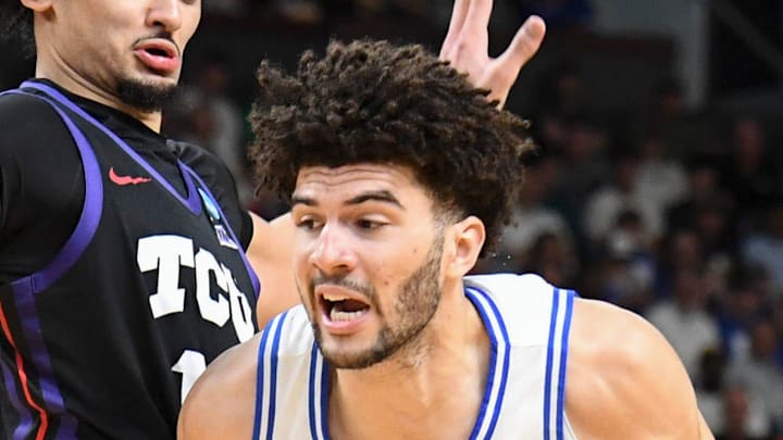 TCU Horned Frogs forward David Punch (15) defends Duke Blue Devils forward Cameron Boozer (12) Saturday, March 21, 2026, during the NCAA Men’s Basketball Tournament second round game at Bon Secours Wellness Arena in Greenville, South Carolina.