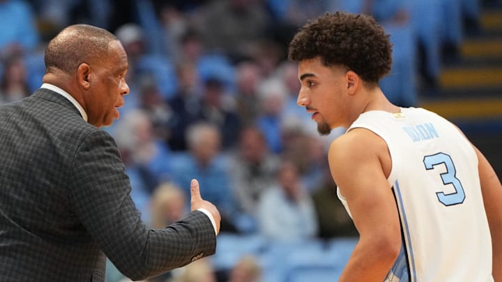 Jan 21, 2026; Chapel Hill, North Carolina, USA; North Carolina Tar Heels head coach Hubert Davis with guard Derek Dixon (3) in the first half at Dean E. Smith Center. Mandatory Credit: Bob Donnan-Imagn Images