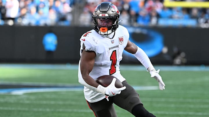 Dec 21, 2025; Charlotte, North Carolina, USA; Tampa Bay Buccaneers running back Rachaad White (1) with the ball in the third quarter at Bank of America Stadium. Dec 21, 2025; Charlotte, North Carolina, USA; Tampa Bay Buccaneers running back Rachaad White (1) with the ball in the third quarter at Bank of America Stadium.