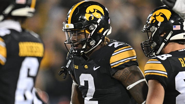 Nov 18, 2023; Iowa City, Iowa, USA; Iowa Hawkeyes running back Kaleb Johnson (2) reacts with wide receiver Nico Ragaini (89) during the fourth quarter against the Illinois Fighting Illini at Kinnick Stadium. Mandatory Credit: Jeffrey Becker-Imagn Images