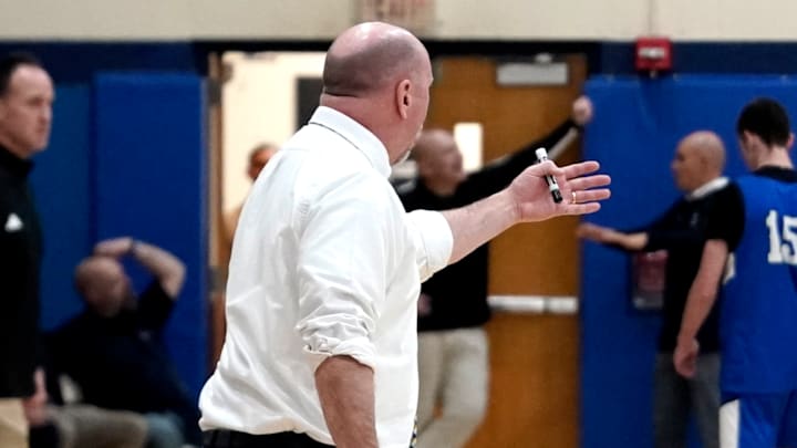 Newington boys basketball coach Scot Wenzel is pictured on the sidelines during his team’s regular season matchup against Hall. 