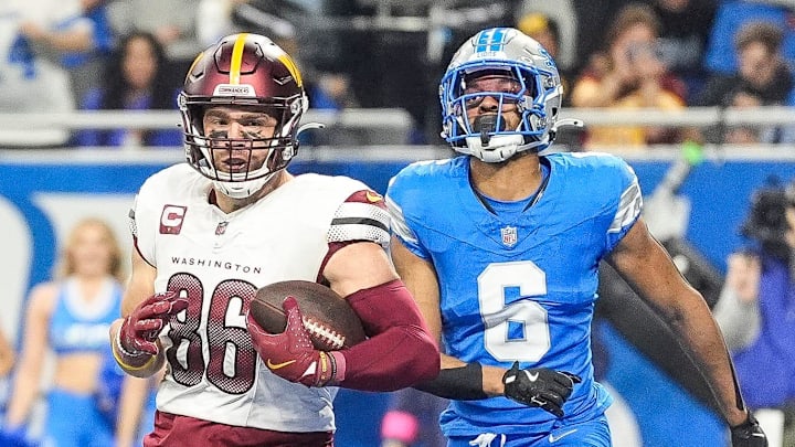 Washington Commanders tight end Zach Ertz (86) scores a touchdown against Detroit Lions safety Ifeatu Melifonwu (6) during the first half of the NFC divisional round at Ford Field in Detroit on Saturday, Jan. 18, 2025.