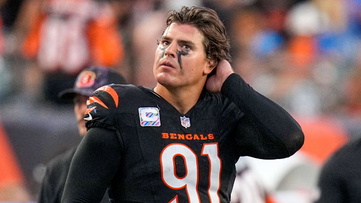 Cincinnati Bengals defensive end Trey Hendrickson (91) watches a replay as the Detroit Lions celebrate a touchdown in the fourth quarter of the NFL Week 5 game between the Cincinnati Bengals and the Detroit Lions at Paycor Stadium in downtown Cincinnati on Sunday, Oct. 5, 2025. The Bengals continued a losing streak, falling 37-24 to the Lions.