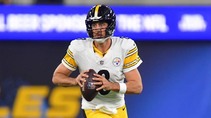 Nov 9, 2025; Inglewood, California, USA; Pittsburgh Steelers quarterback Aaron Rodgers (8) scrambles with the ball against the Los Angeles Chargers during the first quarter of the game at SoFi Stadium. Mandatory Credit: Gary A. Vasquez-Imagn Images