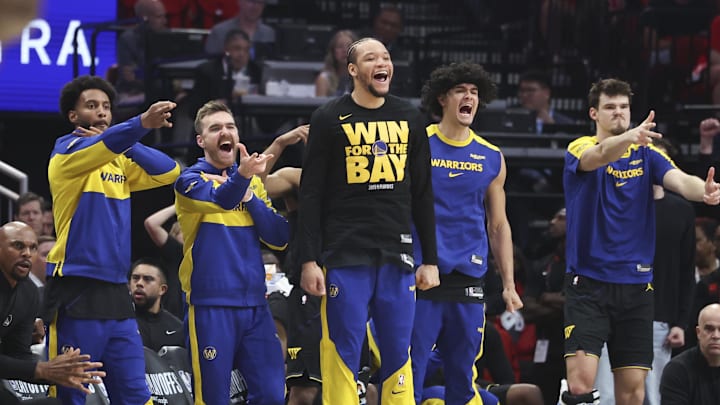 May 4, 2025; Houston, Texas, USA; Golden State Warriors bench players celebrate after a basket by guard Buddy Hield (not pictured) during the second quarter of game seven of the first round for the 2025 NBA Playoffs against the Houston Rockets at Toyota Center. Mandatory Credit: Troy Taormina-Imagn Images May 4, 2025; Houston, Texas, USA; Golden State Warriors bench players celebrate after a basket by guard Buddy Hield (not pictured) during the second quarter of game seven of the first round for the 2025 NBA Playoffs against the Houston Rockets at Toyota Center. Mandatory Credit: Troy Taormina-Imagn Images