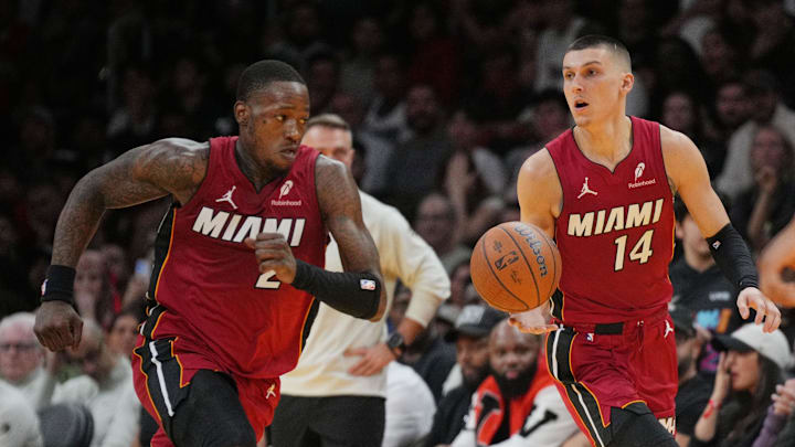Nov 29, 2024; Miami, Florida, USA;  Miami Heat guard Tyler Herro (14) brings the ball up court as teammate guard Terry Rozier (2) follows during the second half in an NBA Cup game at Kaseya Center. Mandatory Credit: Jim Rassol-Imagn Images