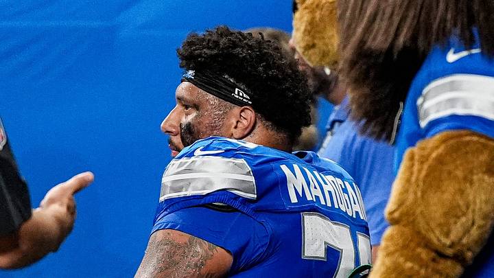 Detroit Lions offensive lineman Christian Mahogany (73) is taken off the field due to an injury during the first half against New Orleans Saints at Ford Field in Detroit on Sunday, Sept. 13, 2026.