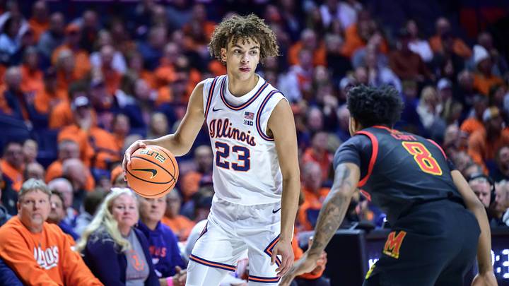 Jan 21, 2026; Champaign, Illinois, USA; Illinois Fighting Illini guard Keaton Wagler (23) brings the ball up against Maryland Terrapins guard David Coit (8) in the first half at State Farm Center. Mandatory Credit: Fred Zwicky-Imagn Images