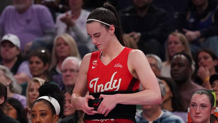 May 28, 2026; San Francisco, California, USA;  Indiana Fever guard Caitlin Clark (22) puts on a Hyperice device to help with her back injury in the second quarter against the Golden State Valkyries at Chase Center. Mandatory Credit: David Gonzales-Imagn Images