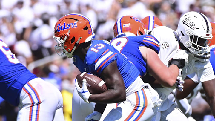 Sep 21, 2024; Starkville, Mississippi, USA; Florida Gators running back Jadan Baugh (13) runs the ball against the Mississippi State Bulldogs during the fourth quarter at Davis Wade Stadium at Scott Field. Mandatory Credit: Matt Bush-Imagn Images