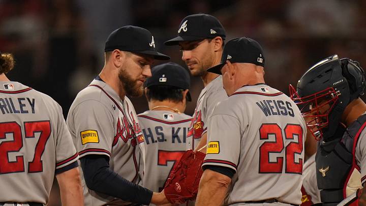 May 26, 2026; Boston, Massachusetts, USA; Atlanta Braves manager Walt Weiss (22) brings in pitcher Dylan Lee (52) against the Boston Red Sox in the sixth inning at Fenway Park. Mandatory Credit: David Butler II-Imagn Images