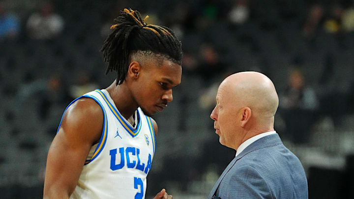 Mar 13, 2024; Las Vegas, NV, USA; UCLA Bruins guard Dylan Andrews (2) is congratulated by Bruins head coach Mick Cronin after the Bruins defeated the Oregon State Beavers 67-57 at T-Mobile Arena. Mandatory Credit: Stephen R. Sylvanie-Imagn Images