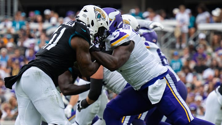 Nov 10, 2024; Jacksonville, Florida, USA; Jacksonville Jaguars defensive end Josh Hines-Allen (41) battles against Minnesota Vikings tackle Cam Robinson (74) in the second quarter at EverBank Stadium. Nov 10, 2024; Jacksonville, Florida, USA; Jacksonville Jaguars defensive end Josh Hines-Allen (41) battles against Minnesota Vikings tackle Cam Robinson (74) in the second quarter at EverBank Stadium.