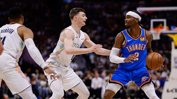 May 15, 2025; Denver, Colorado, USA; Oklahoma City Thunder guard Shai Gilgeous-Alexander (2) controls the ball as Denver Nuggets guard Christian Braun (0) guards in the second quarter during game six of the second round for the 2025 NBA Playoffs at Ball Arena. Mandatory Credit: Isaiah J. Downing-Imagn Images May 15, 2025; Denver, Colorado, USA; Oklahoma City Thunder guard Shai Gilgeous-Alexander (2) controls the ball as Denver Nuggets guard Christian Braun (0) guards in the second quarter during game six of the second round for the 2025 NBA Playoffs at Ball Arena. Mandatory Credit: Isaiah J. Downing-Imagn Images